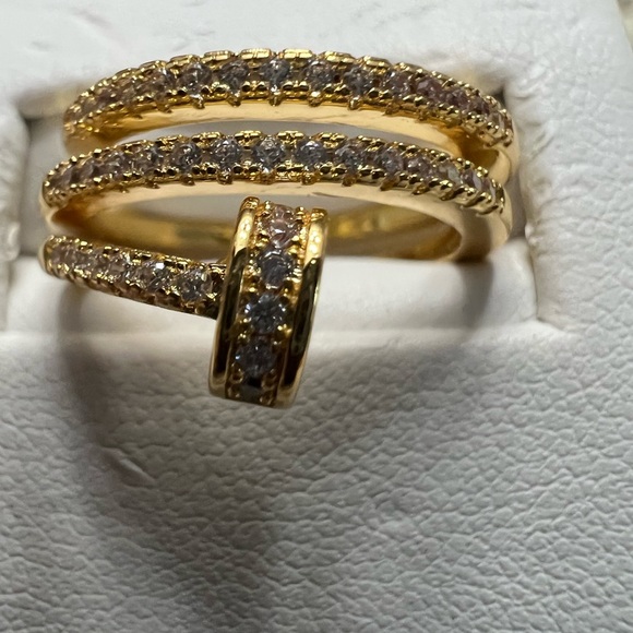 Nail ring size small CZ all around and it’s very different color is Brass gold. - Picture 2 of 5